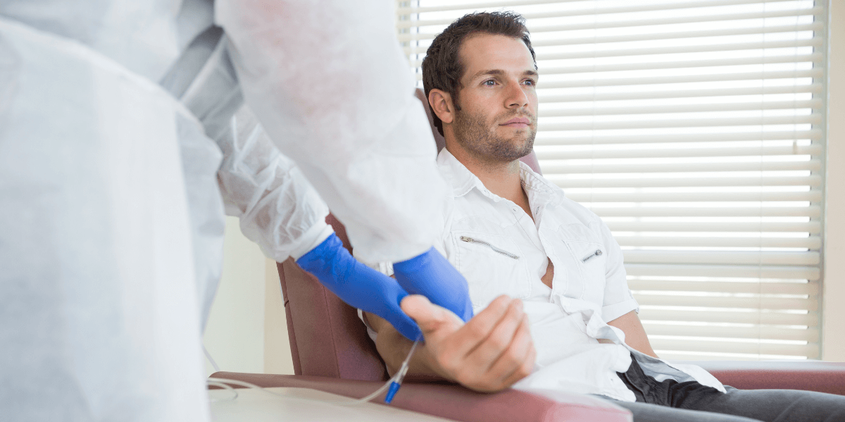 A male patient in a ketamine clinic receiving an NAD+ IV Treatment (1)